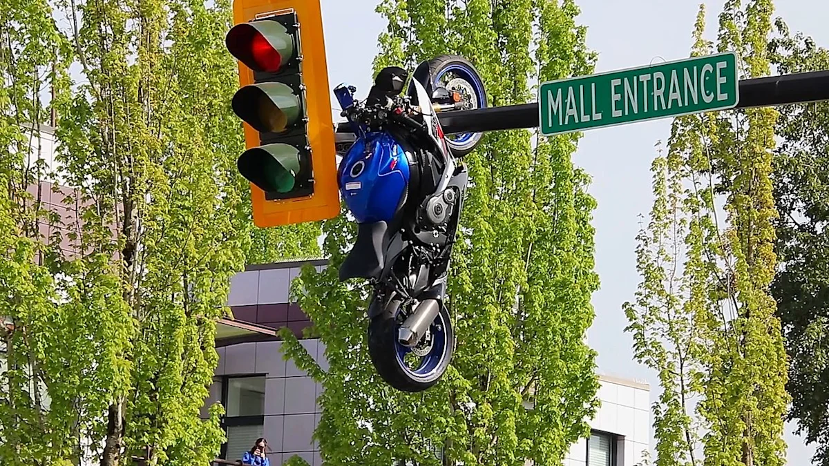 Motorcycle left hanging from traffic light after crash in Canada