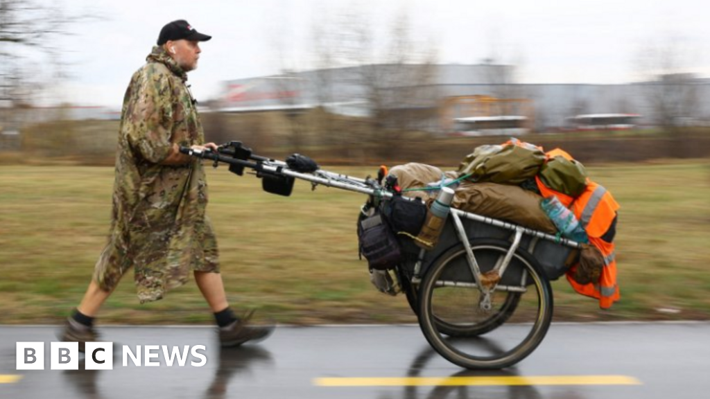 Who is Karl Bushby and why is he walking around the world?