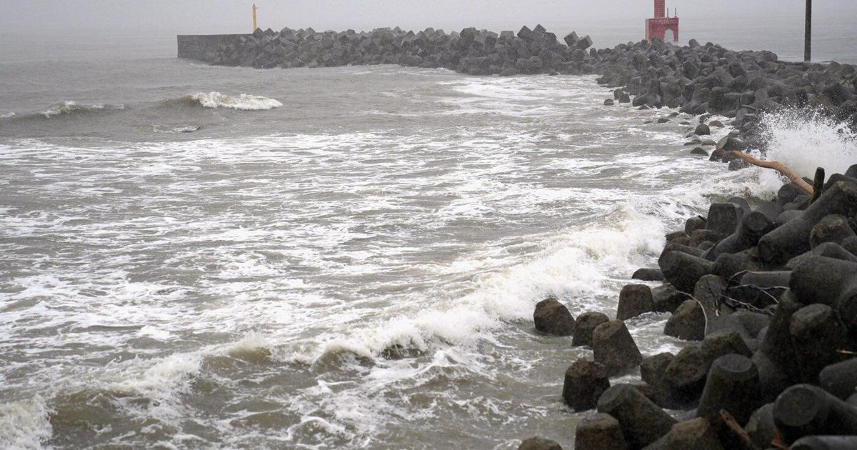 Two tropical storms pound Japan, causing flooding and landslides