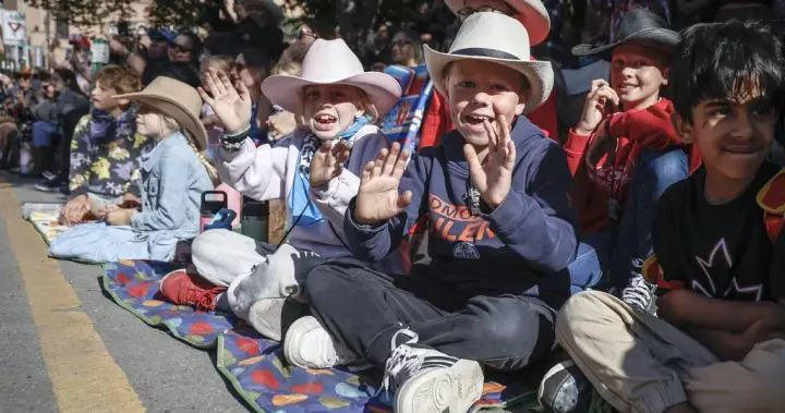 Alberta’s premier gets cheers and jeers as she rolls through Stampede parade