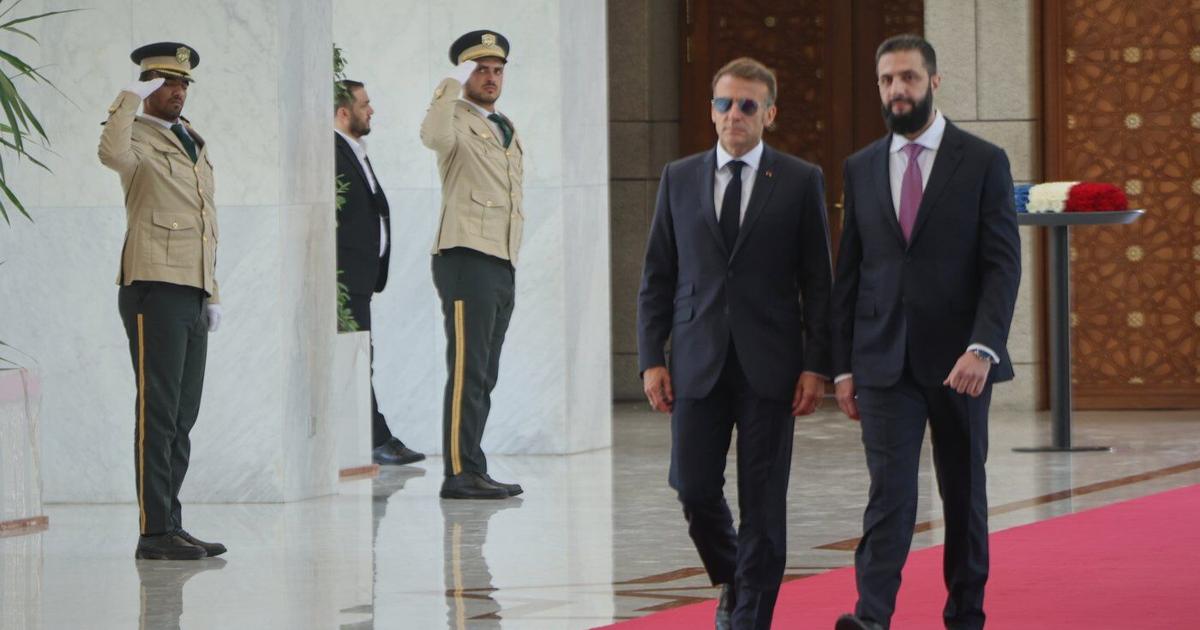 Explosions rock Syria's capital as French President Macron visits