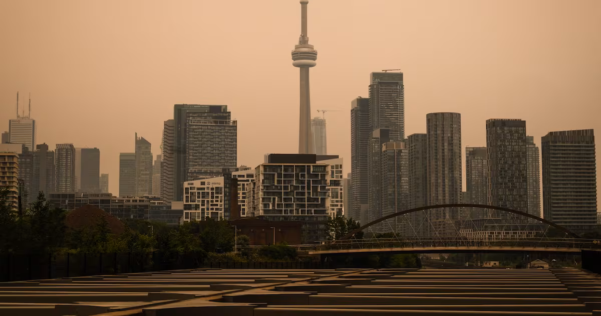 Orange haze envelops Toronto as wildfire smoke moves into city. Live updates here.
