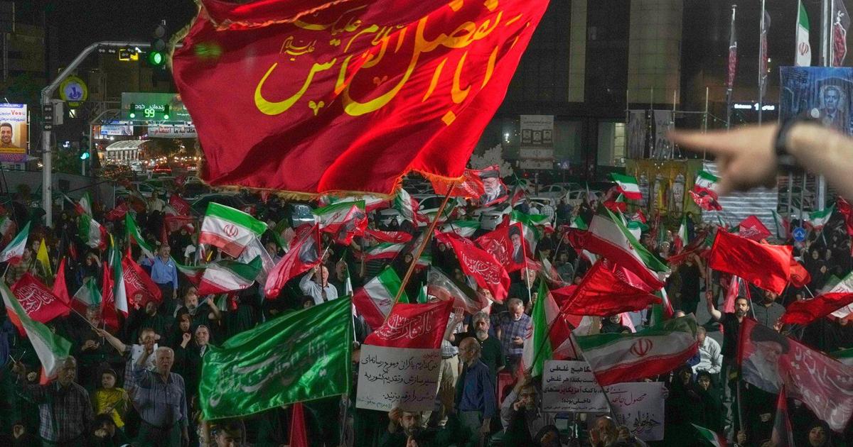 Iran says it is suspending commitments to interim deal with US as the two exchange attacks