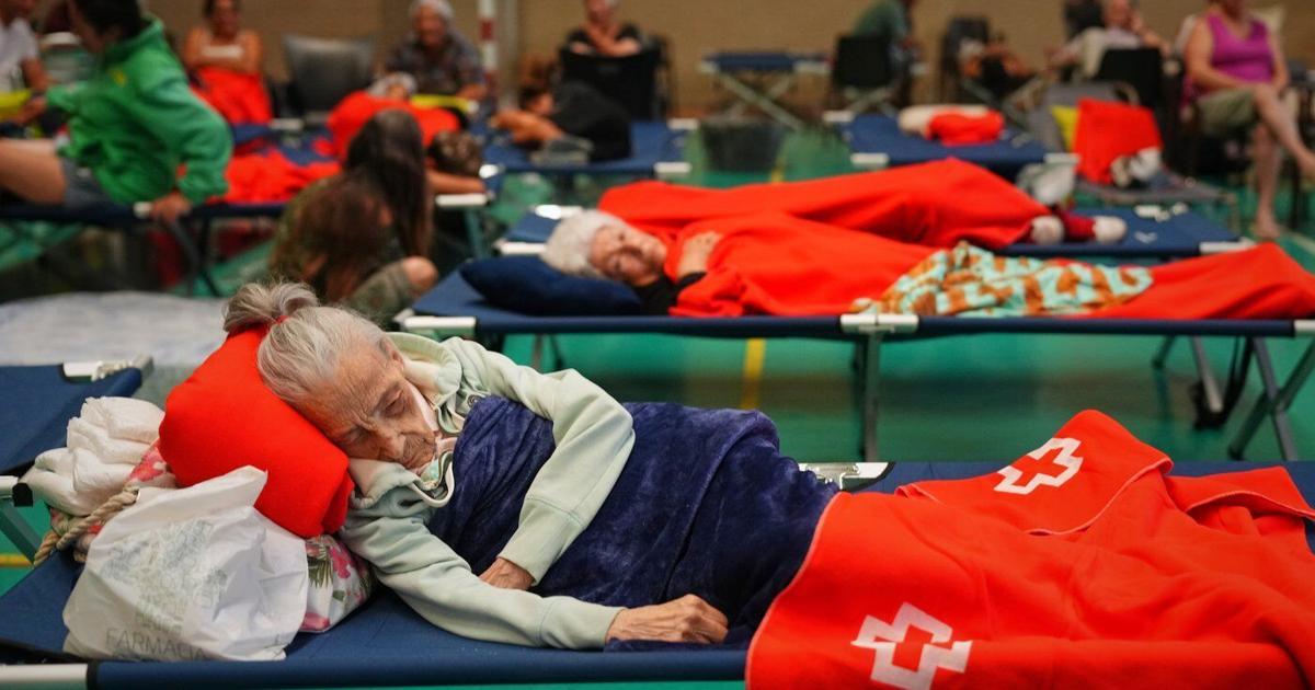 More than 200,000 people flee raging wildfires in France and Spain, some escaping by boat