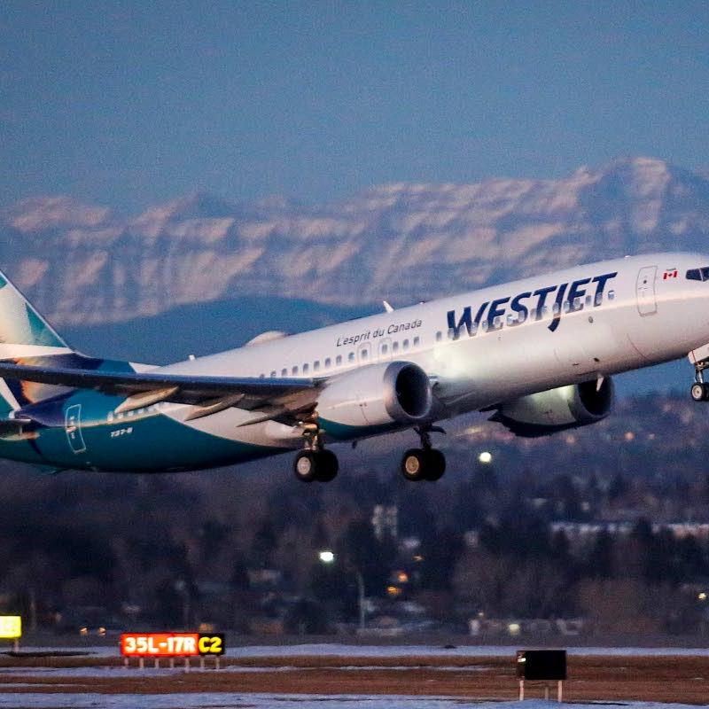 WestJet flight attendants threaten to strike during long August weekend in Canada