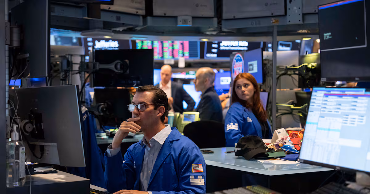 World shares are mostly lower after Wall Street retreats following economic updates