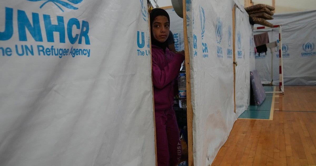 A basketball court shelters displaced families in Lebanon, in photos