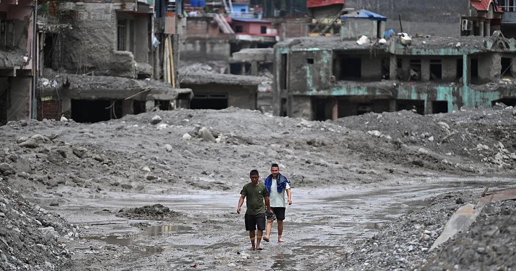 Nepal on high alert for fresh flooding after river levels rise as death toll soars past 800