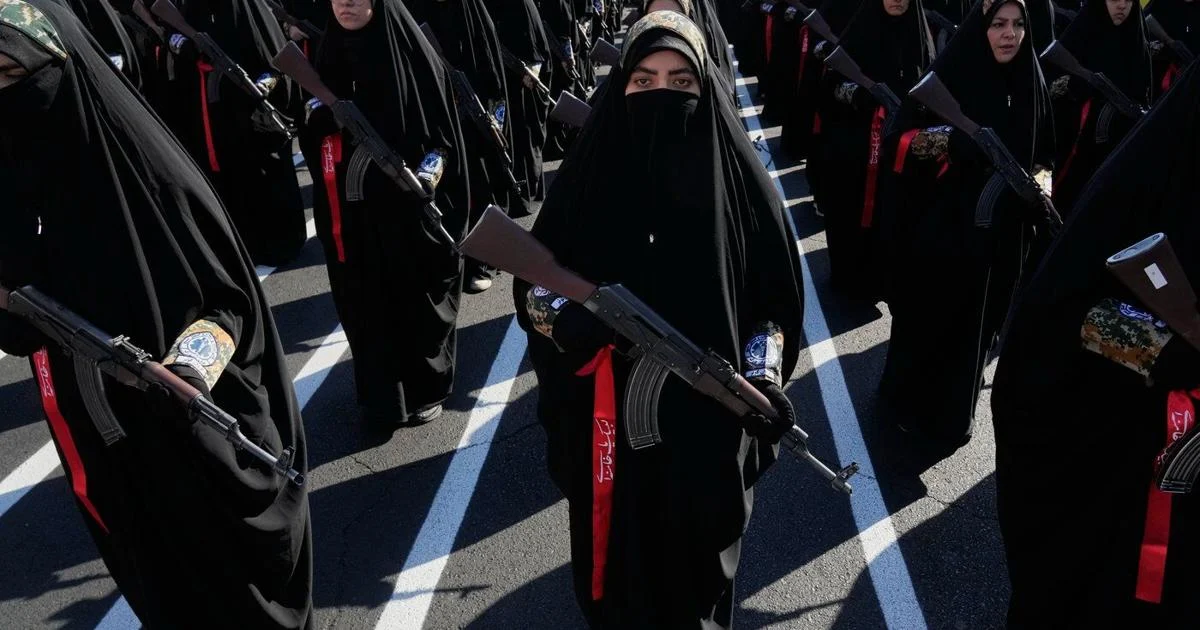 Iran stages massive Tehran rally as volunteers pledge to take up arms, in photos
