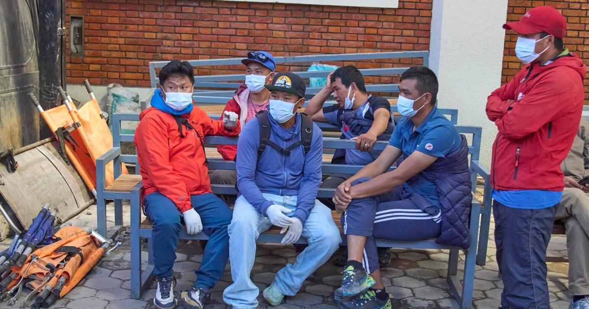 Rescue teams search Nepal mountain for 12 swept by avalanche
