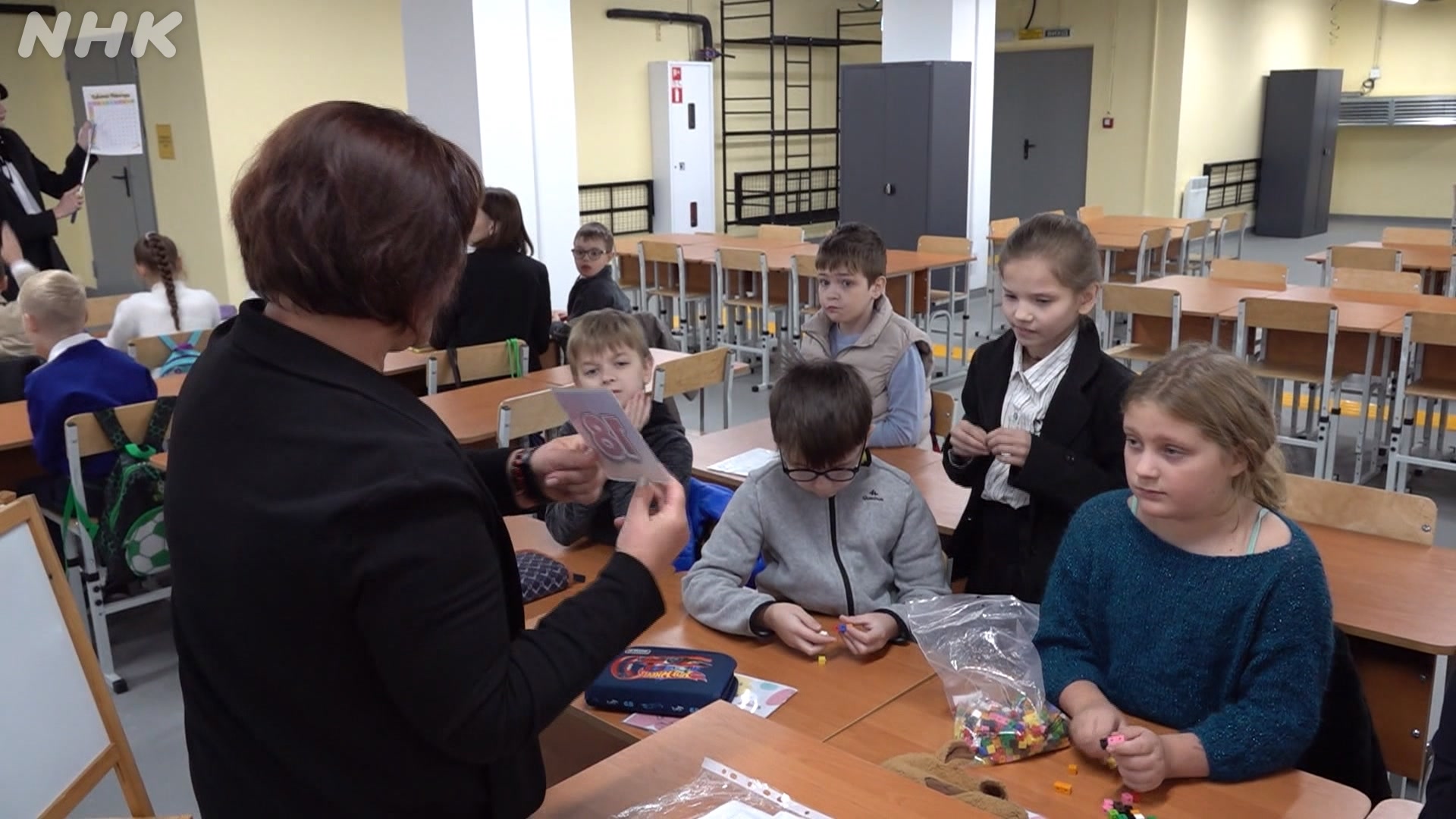 Ukrainian school children study at huge shelter