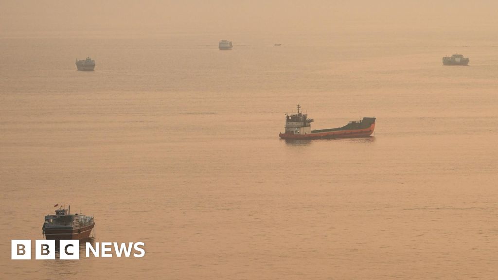Container ship sinks in Strait of Hormuz after being hit by projectile, Singapore says