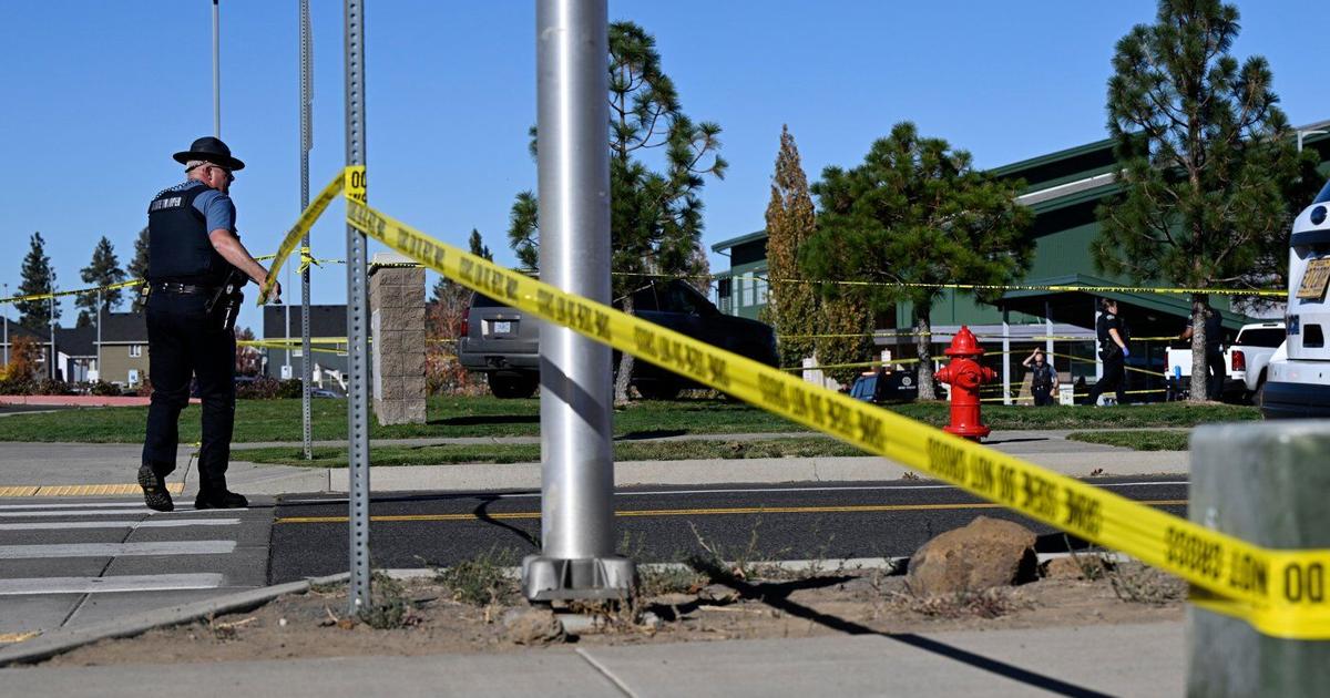 The Latest: Teacher threw cellphone and tackled gunman who killed 4 at Oregon school, police say