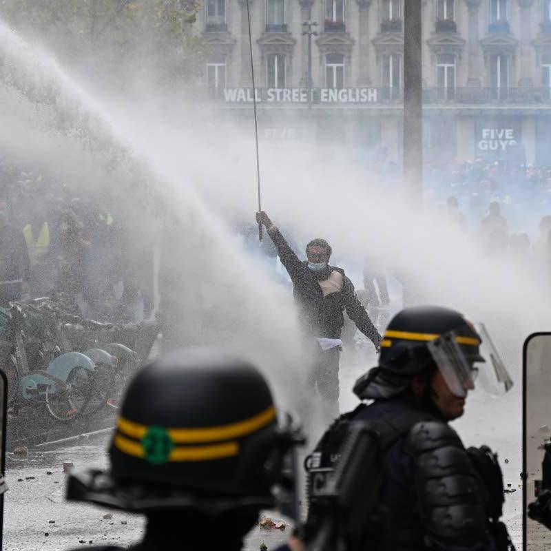 Scuffles and fires break out as protesters rally across France, joining students